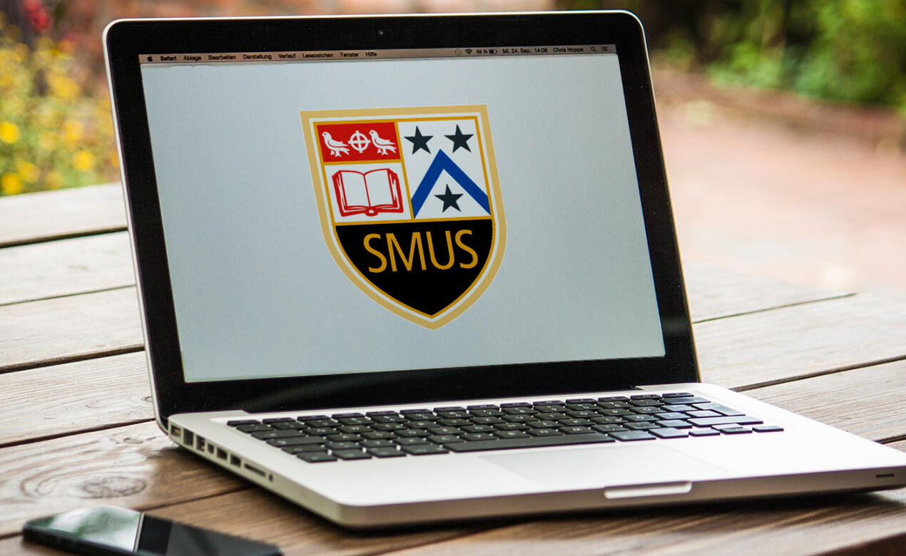 Laptop with SMUS logo on screen