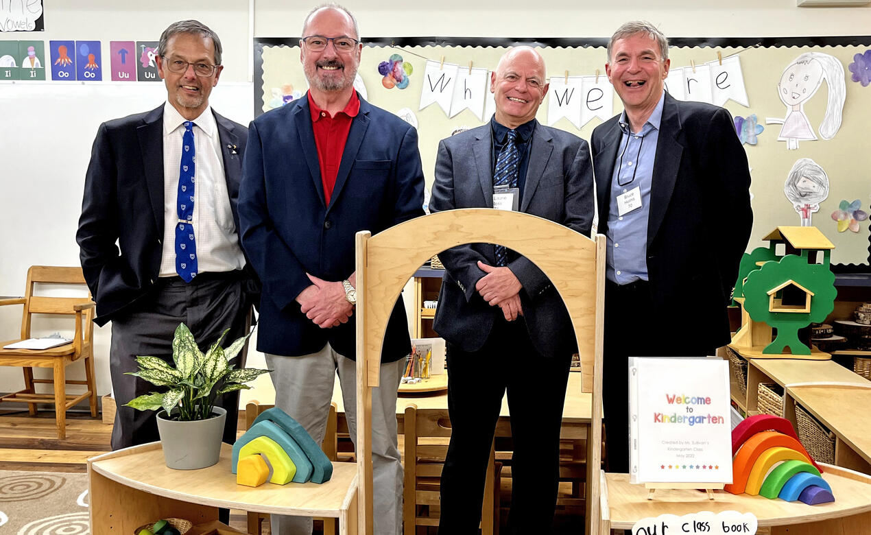 A group of St. Michael's School Old Boys pose for a photo in the current Kindergarten classroom at the Junior School