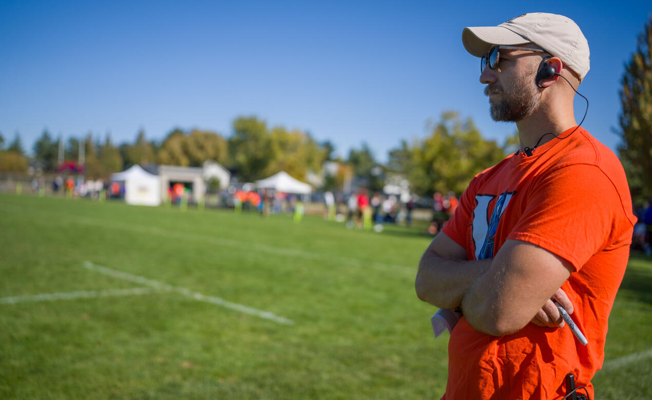 UVic men's rugby head coach Scott Manning looks out over the rugby field intensely. 