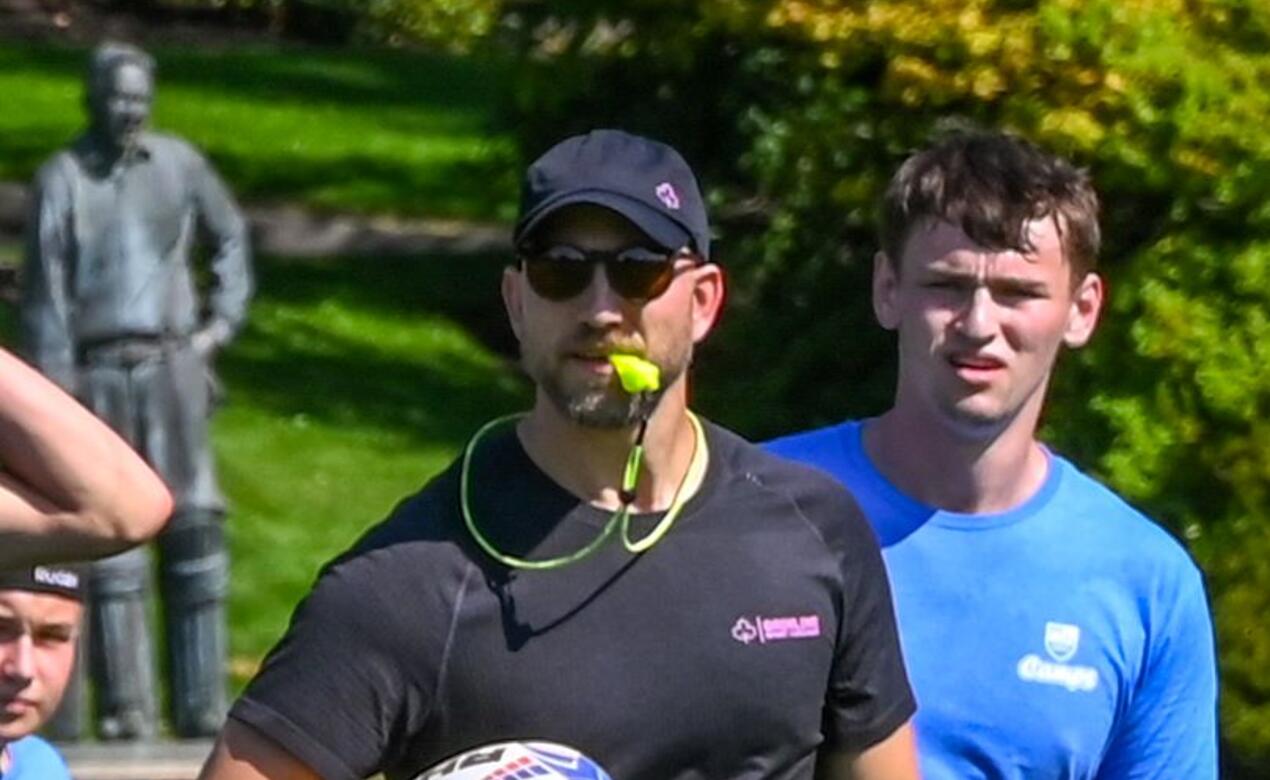 Scott Manning Rugby Coach with rugbyball in hand and a whistle in his mouth