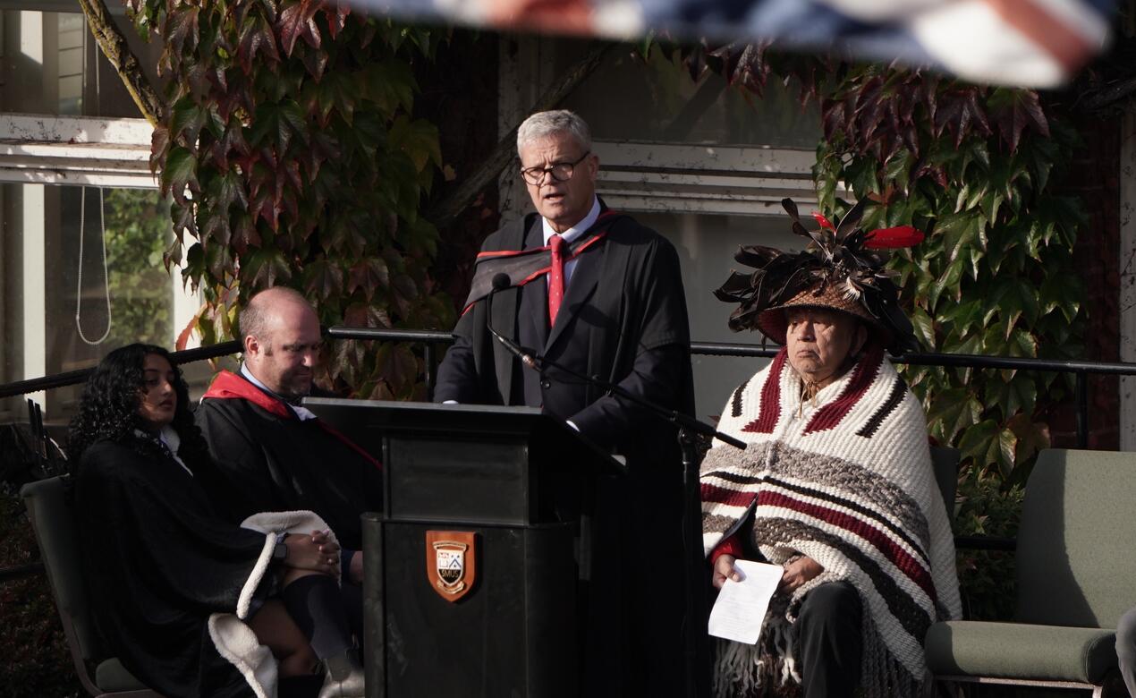 Head of School Mark Turner, dressed in regalia, addresses the crowd at the Oct. 22 Welcome Pole Ceremony. 