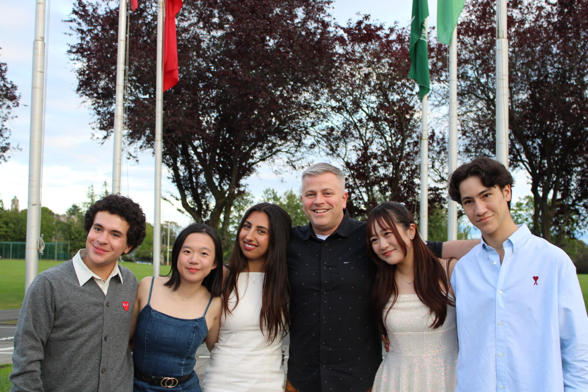 Students pose out on the quad with Howard Cafe manager Jon Perkins